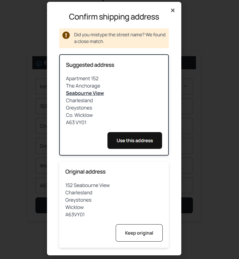 Modal titled 'Confirm shipping address' showing an alert bar, a 'Suggested address' block with a 'Use this address' button, and an 'Original address' block with a 'Keep original' button.